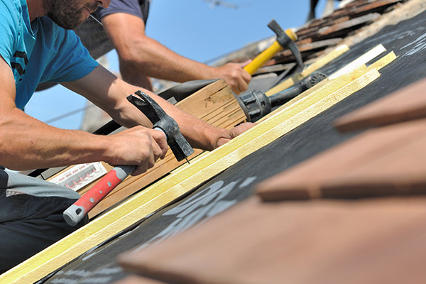 Roofs R Us roofing team fixing a room in Maple Grove after severe storm damage