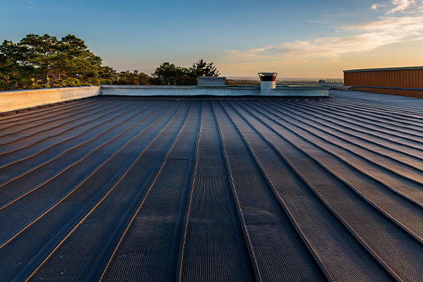 Flat roof on commercial building show types of commercial roofs