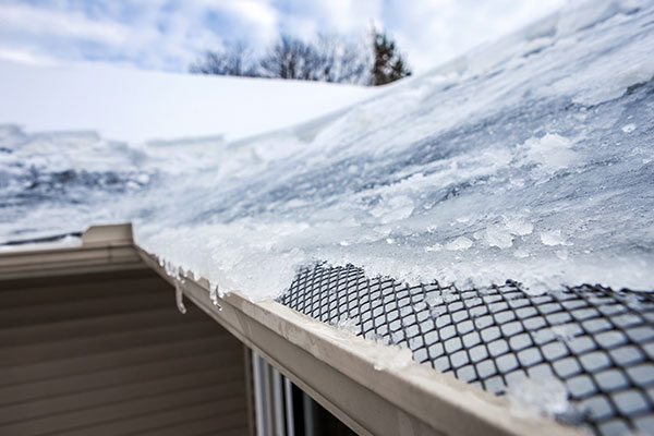 How Ice Dams Can Damage Your Roof and What to Do About Them